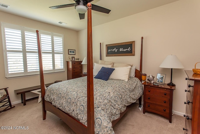 bedroom featuring ceiling fan and light carpet