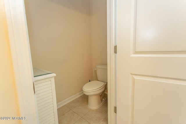 bathroom featuring toilet and tile patterned floors