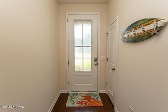 entryway with dark hardwood / wood-style flooring