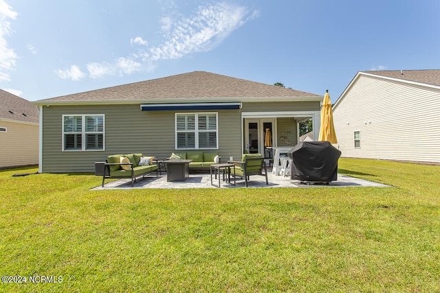 back of property with a patio area, an outdoor hangout area, and a yard