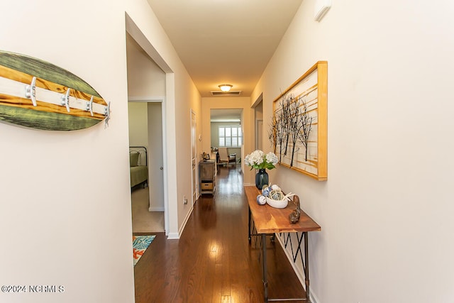 hallway featuring dark wood-type flooring