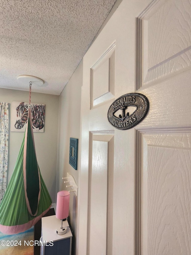 interior details with a textured ceiling