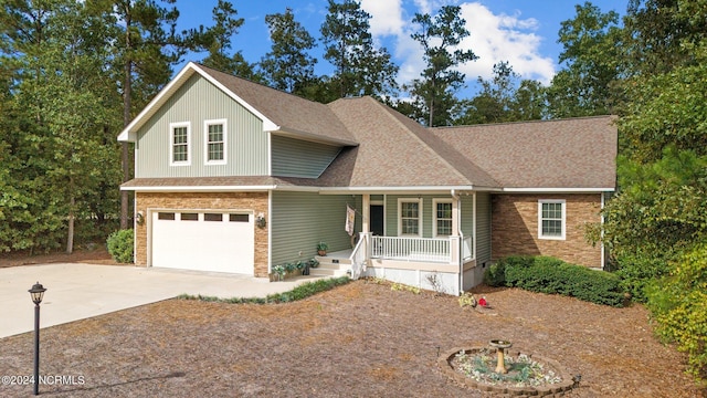 view of front of house featuring covered porch and a garage