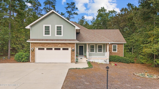 front facade featuring a porch and a garage