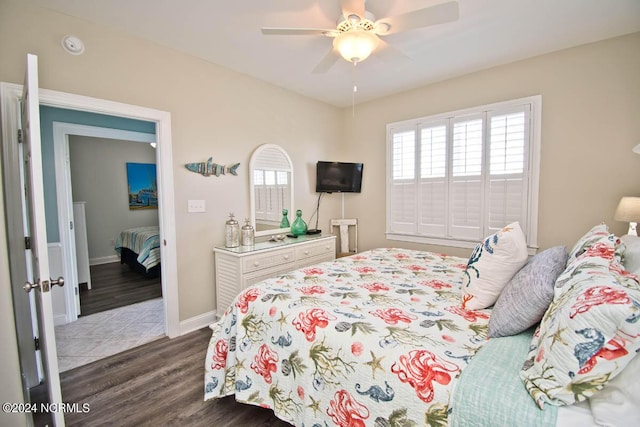 bedroom with ceiling fan and dark wood-type flooring