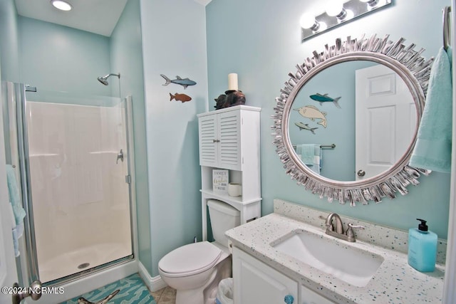 bathroom with tile patterned flooring, vanity, an enclosed shower, and toilet