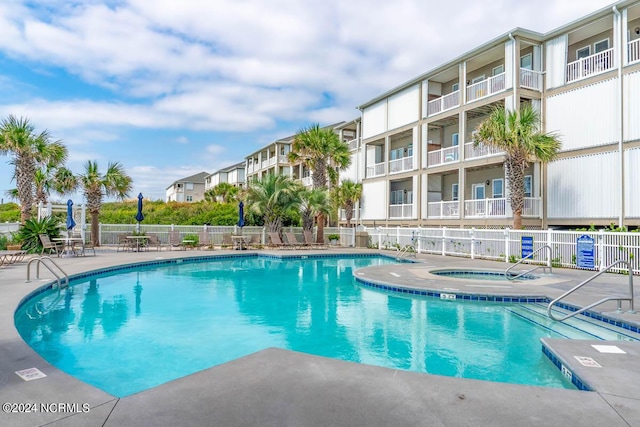 view of pool featuring a hot tub