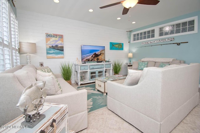 living room featuring ceiling fan and light tile patterned floors