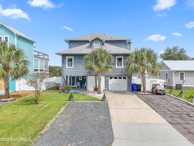 view of front of house with a garage and a front yard