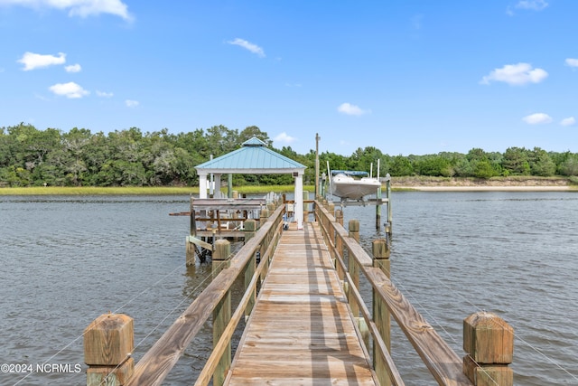 dock area with a gazebo and a water view