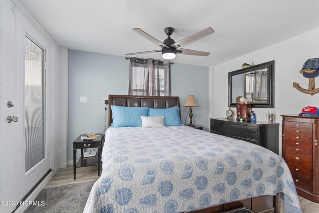 bedroom with light wood-type flooring and ceiling fan