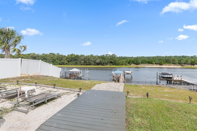 deck with a boat dock and a water view