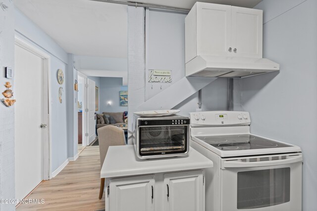 kitchen with white cabinets, light wood-type flooring, and white range with electric stovetop