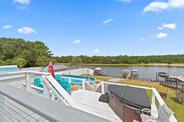 view of pool featuring a water view