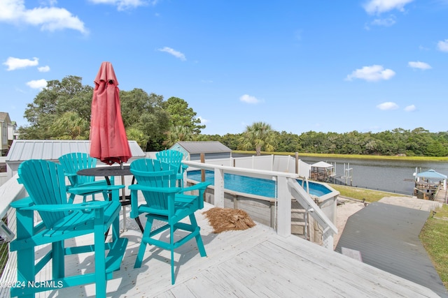 exterior space with a deck with water view