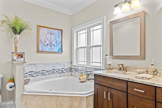 bathroom featuring toilet, a tub with jets, ornamental molding, and vanity