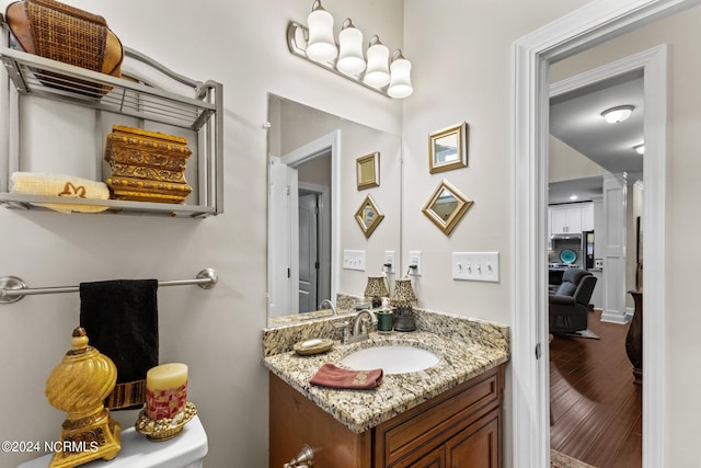 bathroom featuring wood-type flooring and vanity