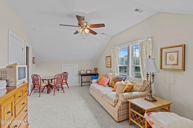 living room with light carpet, ceiling fan, and lofted ceiling