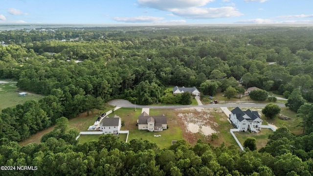 aerial view featuring a wooded view