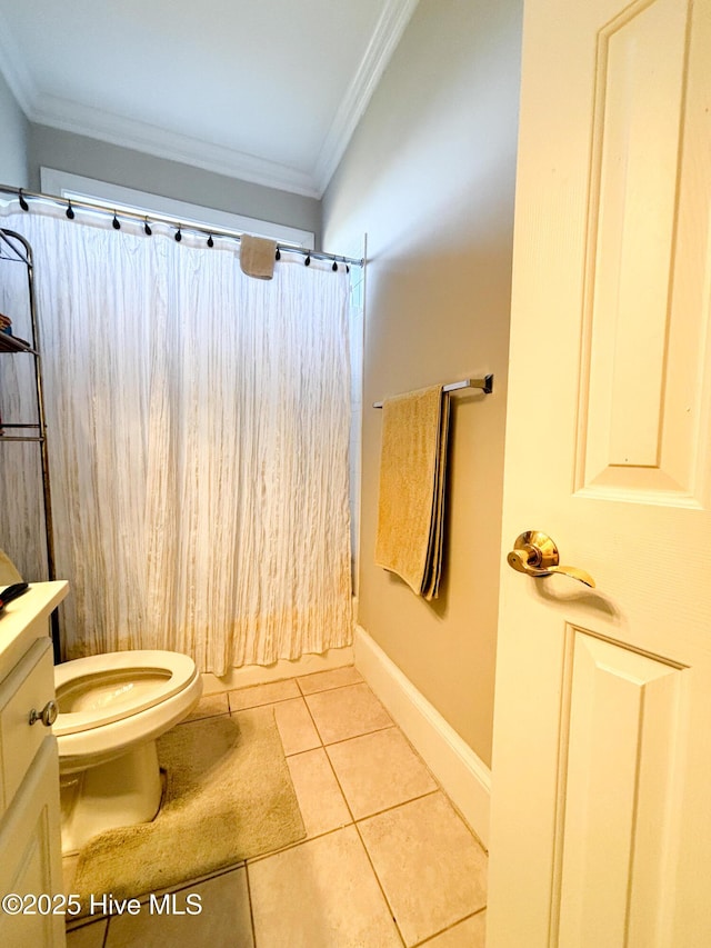 full bathroom featuring tile patterned floors, toilet, crown molding, baseboards, and vanity