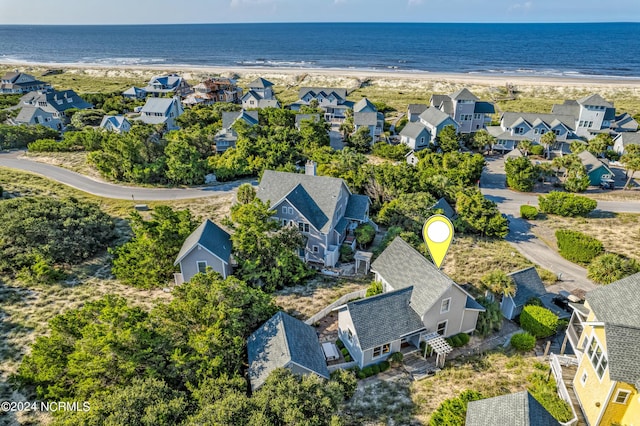 bird's eye view featuring a water view, a residential view, and a beach view