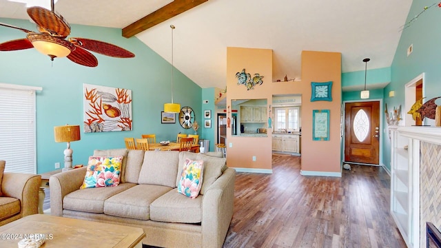 living room with ceiling fan, beam ceiling, wood-type flooring, and high vaulted ceiling