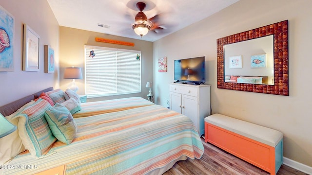 bedroom featuring wood-type flooring and ceiling fan