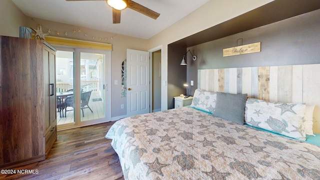 bedroom featuring dark hardwood / wood-style floors, ceiling fan, and access to outside