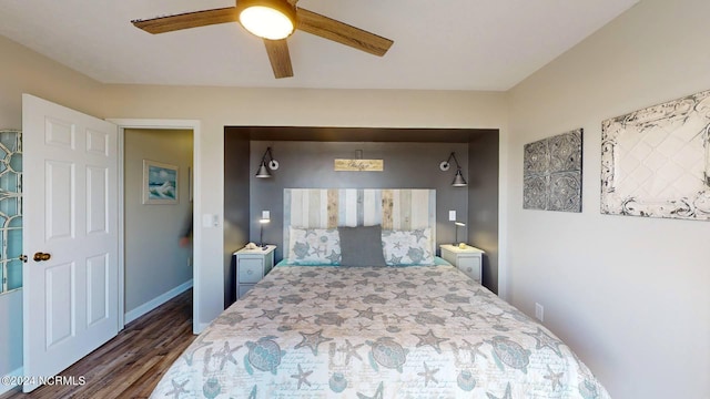 bedroom featuring ceiling fan and dark hardwood / wood-style floors