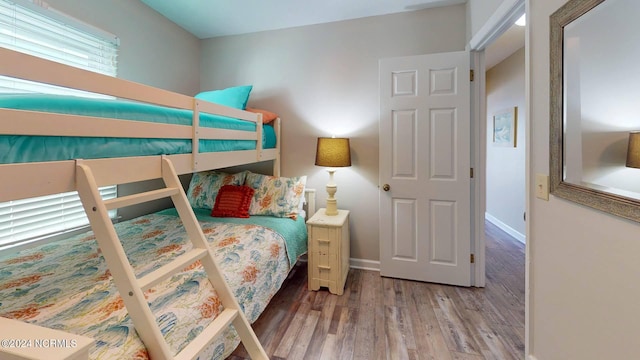 bedroom featuring wood-type flooring