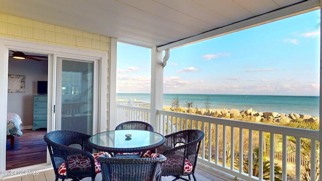 balcony featuring a water view