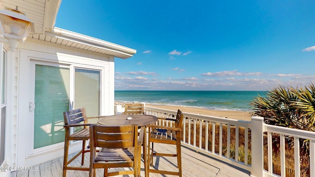 balcony with a beach view and a deck with water view