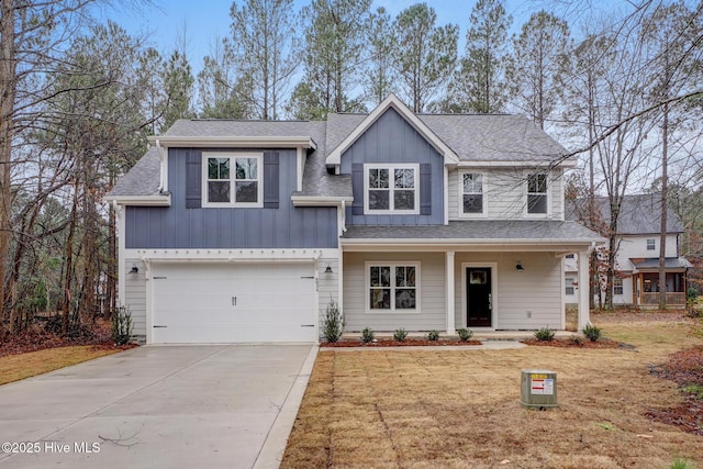 view of front of property featuring a garage and a front yard