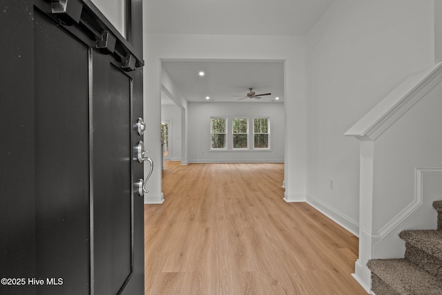 entrance foyer featuring ceiling fan and light hardwood / wood-style floors