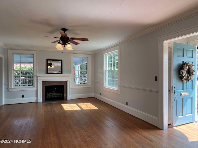 unfurnished living room featuring ornamental molding, hardwood / wood-style flooring, and ceiling fan