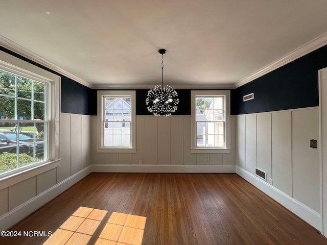 unfurnished dining area with a wealth of natural light, dark wood-type flooring, and an inviting chandelier