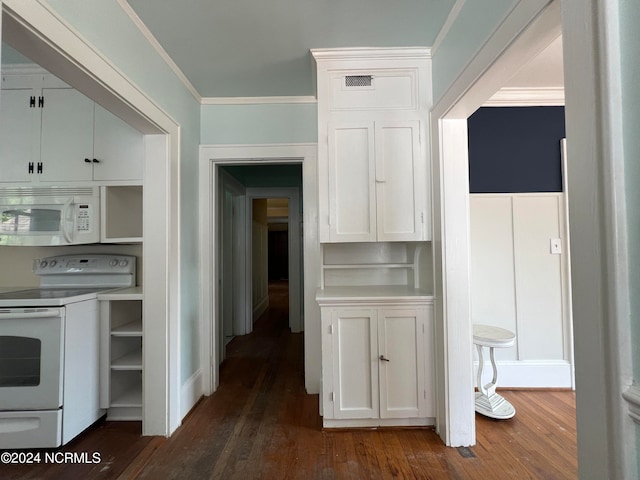 kitchen featuring dark wood-type flooring, white appliances, crown molding, and white cabinetry