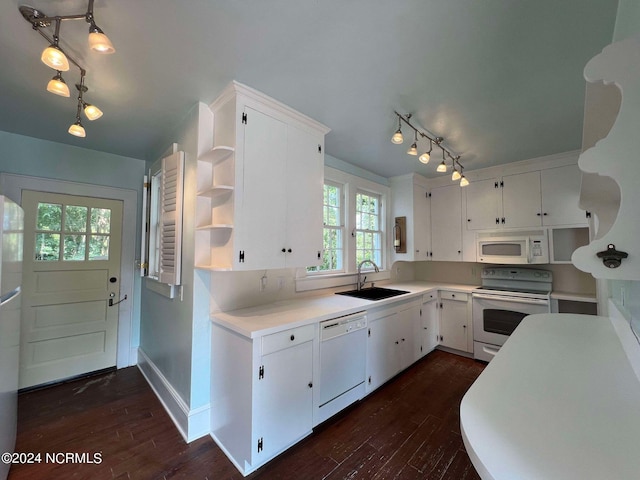 kitchen with white cabinets, dark wood-type flooring, and white appliances