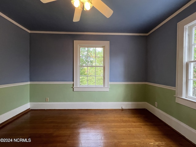 spare room with wood-type flooring, crown molding, and ceiling fan