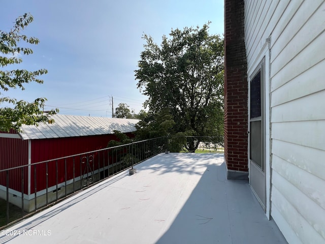 view of patio featuring a balcony