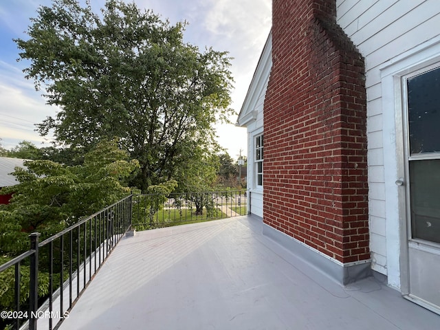 view of patio featuring a balcony