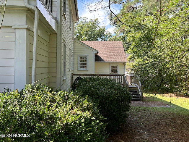 view of side of property featuring a deck