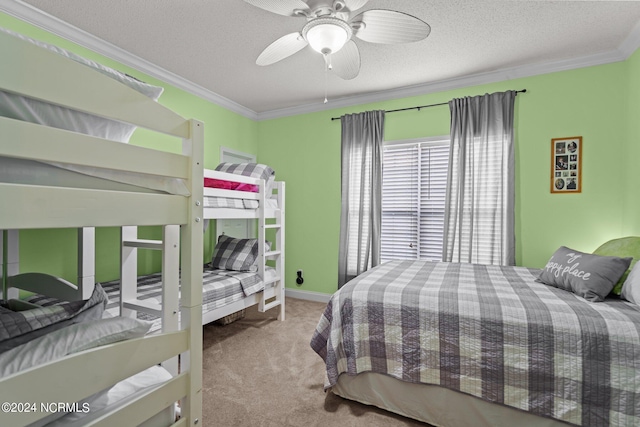 carpeted bedroom featuring a ceiling fan, crown molding, a textured ceiling, and baseboards