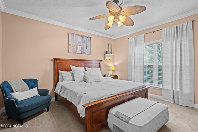 bedroom with ceiling fan, ornamental molding, light carpet, and a textured ceiling