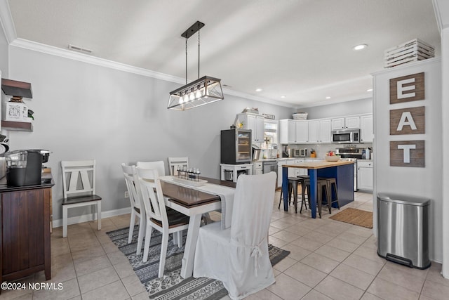 dining space featuring light tile patterned floors, recessed lighting, visible vents, ornamental molding, and baseboards