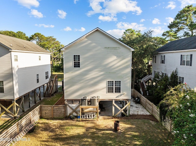 back of house with fence and stairway