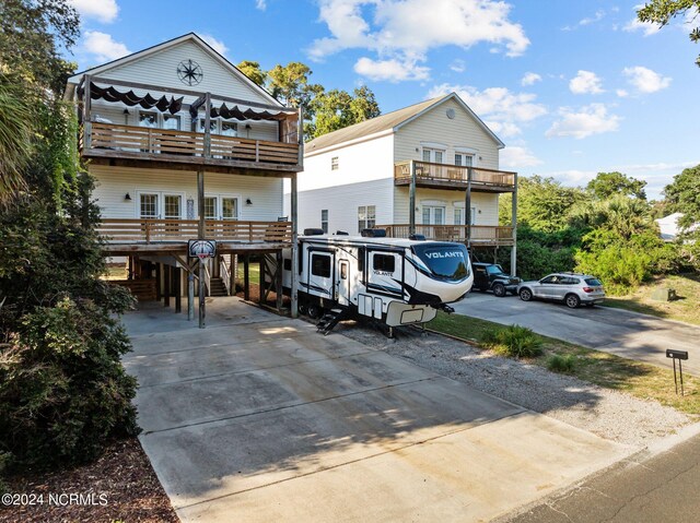 view of front of home with a balcony