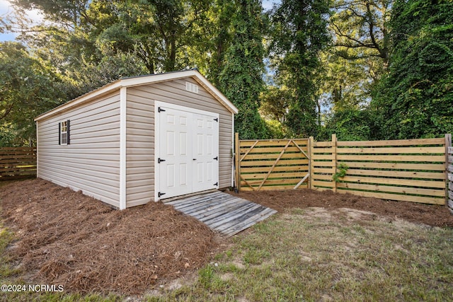 view of shed with a fenced backyard