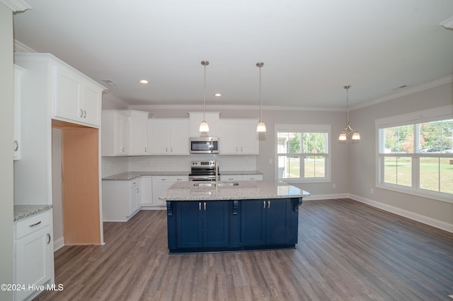 kitchen with blue cabinets, white cabinets, stainless steel appliances, and crown molding