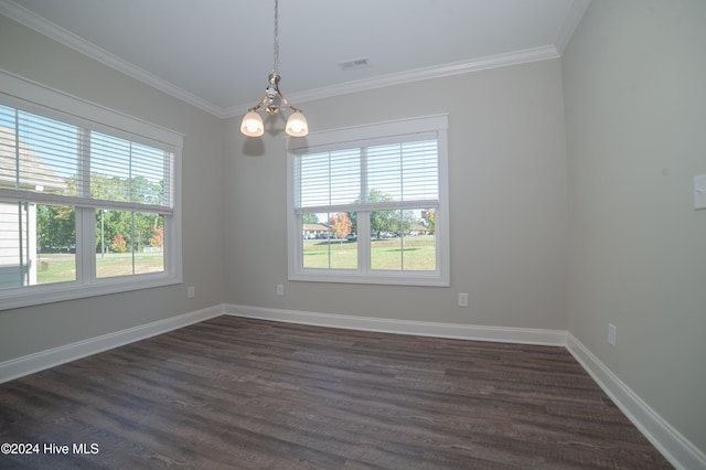 spare room featuring baseboards, dark wood-type flooring, an inviting chandelier, and crown molding